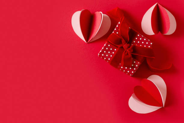 istock Red background flat lay with gift, paper hearts, gift box, valentines day, mothers day concept 1359007253