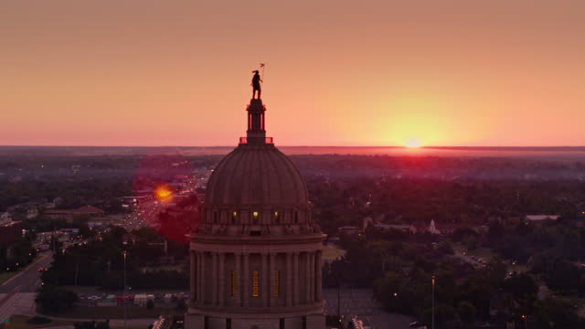 Sun Coming Up Behind the Oklahoma State Capitol Building - Aerial