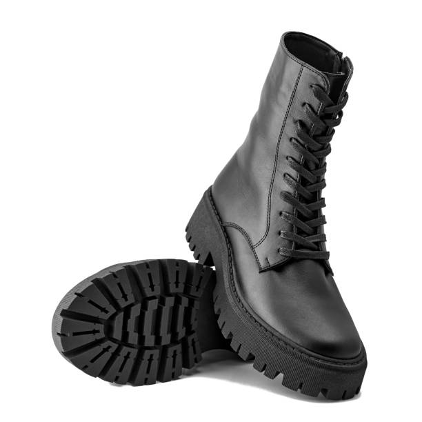 istock Black leather female boots isolated on white background, copy space 1359011600