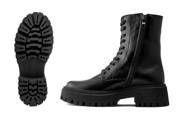 istock Black leather female boots isolated on white background, copy space 1359011601