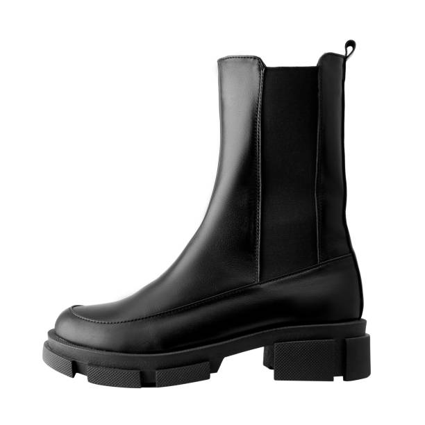 istock Black leather female boots isolated on white background, copy space 1359011605