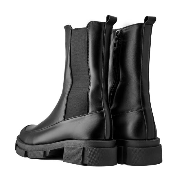 istock Black leather female boots isolated on white background, copy space 1359011618