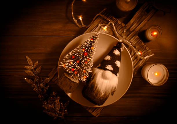 istock decorative christmas tree, gnome on wooden background 1359015714