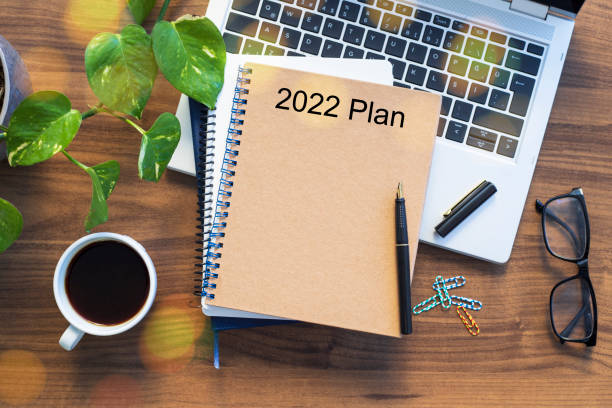 istock Note book with 2022 goals text on it to apply new year resolutions and plan. 1359016861