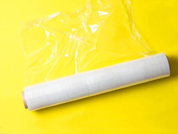 istock roll of wrapping stretch film for packaging on yellow background isolated 1359017852