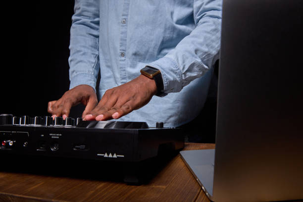 istock African-American DJ works on a music mixer. 1359021272