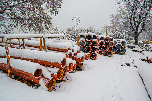 December 12, 2021, Belgrade, Serbia Construction site equipment and machines covered with snow