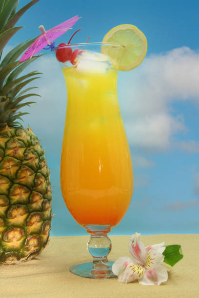 istock Pineapple, Tropical Drink and Fruit on Sand With Sky 1359022811