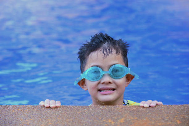 istock Happiness boy in the pool. 1359023715