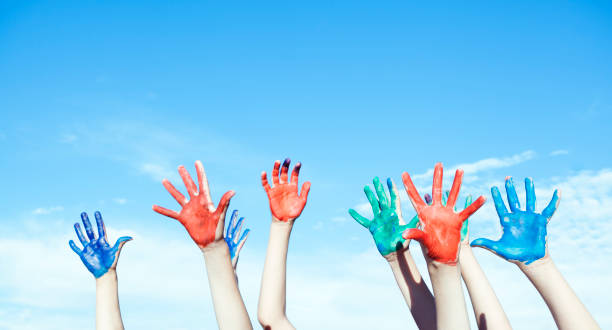istock Happy children painted hands 1359024558