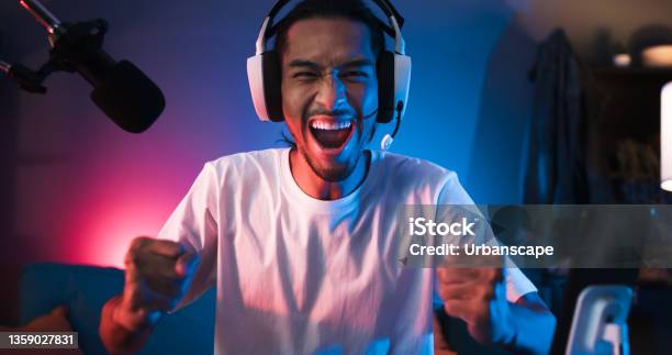 Young Asian Man Playing Online Computer Video Game Colorful Lighting Broadcast Streaming Live At Home Ecstatic Celebration Winning A Match Gamer Lifestyle Esport Online Gaming Technology Concept Stock Photo - Download Image Now