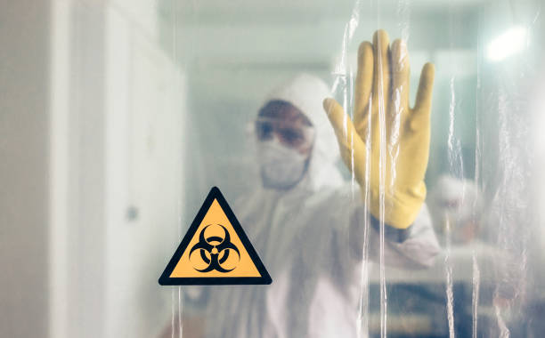 istock Biohazard symbol with unrecognizable doctor prohibiting passage 1359028162