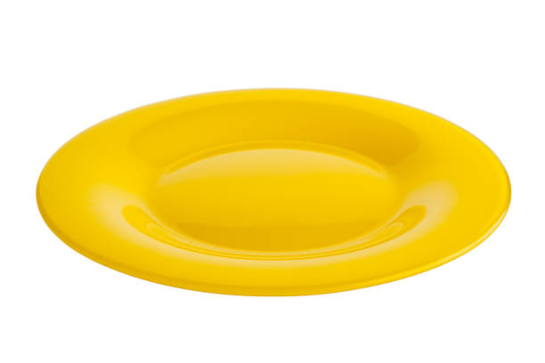 istock yellow glass plate isolated on a white background, dishes for serving dishes, kitchen 1359033185