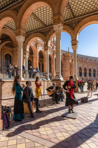 Flamenco at Plaza de España, Seville, Spain. December, 2021. Seville, Spain. A group of Flamenco aritsts - dancer, percussionist, guitarrist and singer - performing in Plaza de España outdoors, seville photos stock pictures, royalty-free photos & images