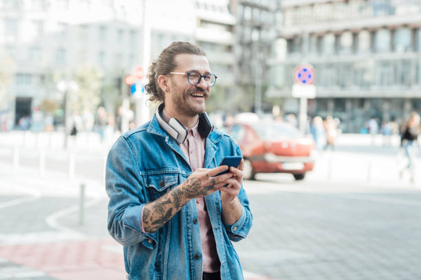 istock Young man surfing the net on the move 1359036332