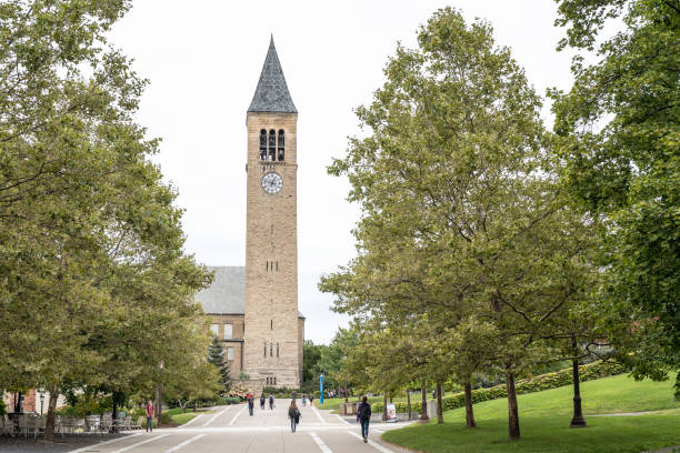 McGraw Clock Tower, Cornell University Ithaca, New York, September 1, 2019: Students walk on main walkway leading up to McGraw Clock Tower, Cornell University. ithaca stock pictures, royalty-free photos & images