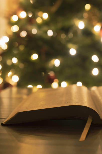 istock Close up open bible and Christmas tree 1359037979