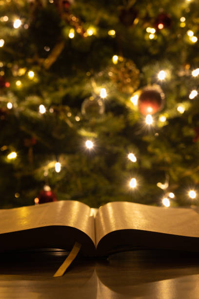 istock Partial bible in front of Christmas tree 1359037999