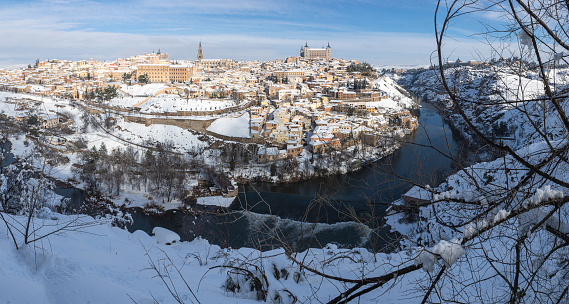 beautiful panoramic view from the viewpoint of the snowy Toledo Valley surrounded by the Tagus river in the morning after the snowfall