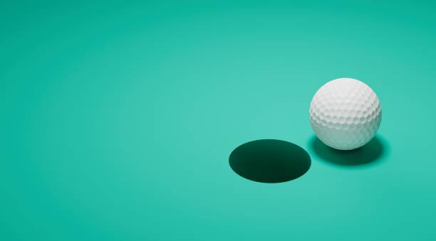 istock Golf ball and golf hole metaphor analogy 1359040506