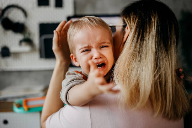 Baby crying stock photo