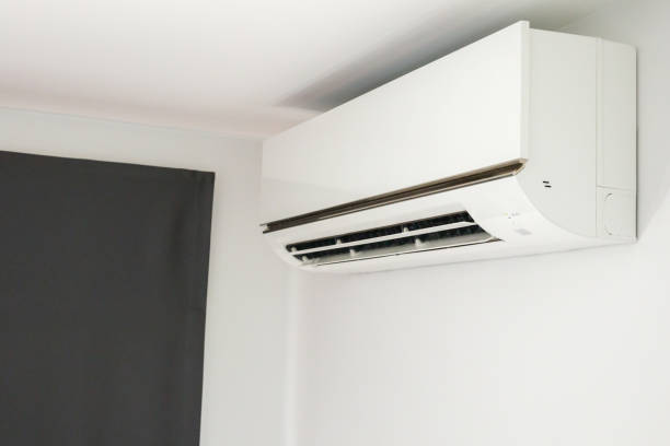 istock Air conditioner on white wall room interior background 1359043913