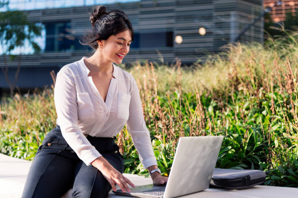 istock businesswoman working with computer in a park 1359044019