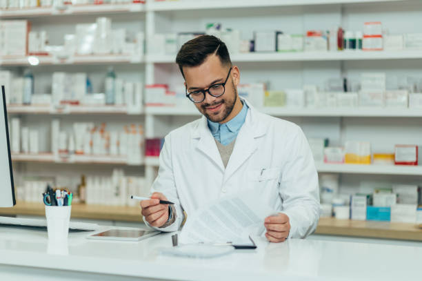 istock Portrait of a handsome pharmacist working in a pharmacy 1359044244