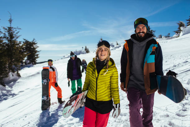istock Two snowboarders on their way to the slopes 1359048744