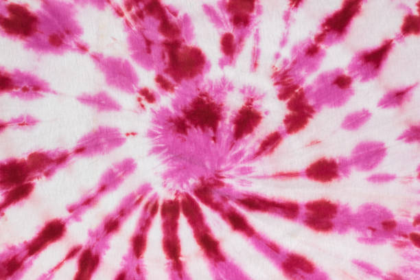 istock White fabric painted in a spiral red and white tie dye style. Flat lay. 1359054617