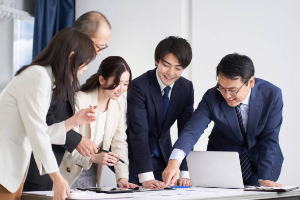 istock Asian business woman explaining at a meeting 1359056740