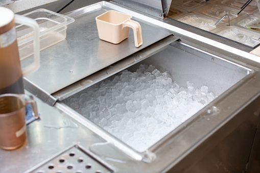 A view of a commercial grade ice storage bin, seen at a local drink restaurant.