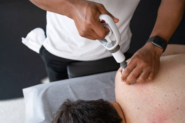 istock Professional performing vacuum cupping therapy on a client 1359061057
