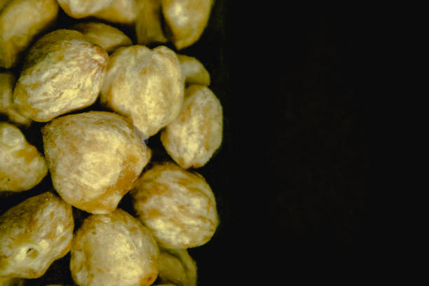 istock Candlenut seeds in a glass bottle 1359061876