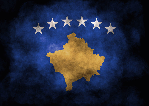 Closeup of grunge Kosovo flag