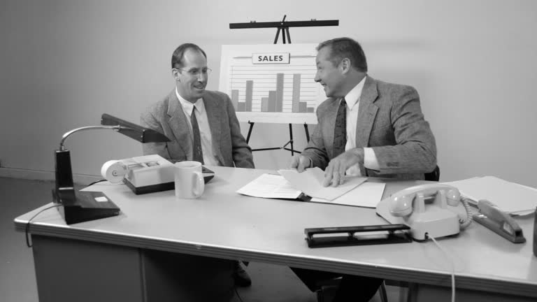 Business men meet and talk at desk