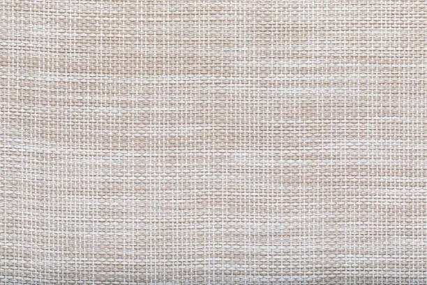 abstract woven synthetic rug texture, closeup.