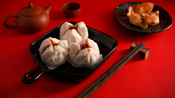 istock Steamed red minced pork buns, fried shrimp dumplings. Chinese appetiser 1359070160