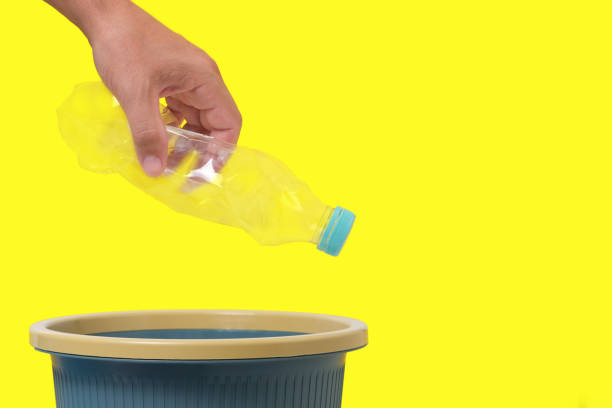 istock An empty plastic bottle in his hand is thrown into trash. 1359071070