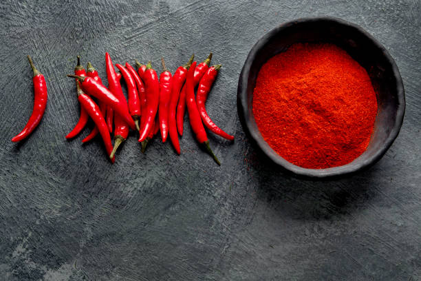 istock Red chili or chilli cayenne pepper on dark background. 1359074862