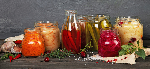 Fermented food on wooden table. High source of probiotics. Front view