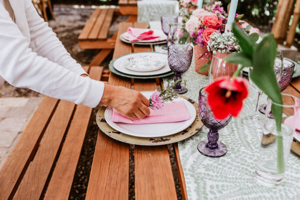 istock table setup with flowers, glasses and plates on table decorated for Wedding Reception in terrace Latin America 1359079614