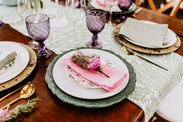 istock table setup with flowers, glasses and plates on table decorated for Wedding Reception in terrace Latin America 1359079647