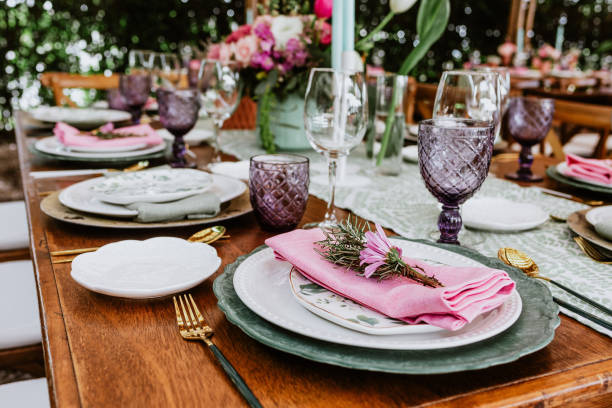 istock table setup with flowers, glasses and plates on table decorated for Wedding Reception in terrace Latin America 1359079721
