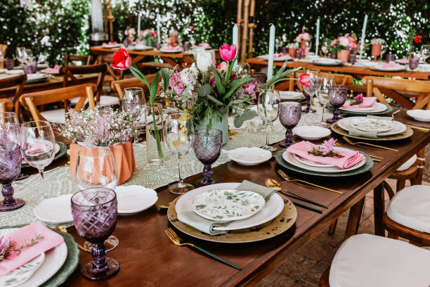 istock table setup with flowers, glasses and plates on table decorated for Wedding Reception in terrace Latin America 1359079841