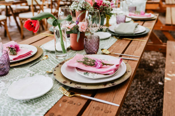 istock table setup with flowers, glasses and plates on table decorated for Wedding Reception in terrace Latin America 1359079913