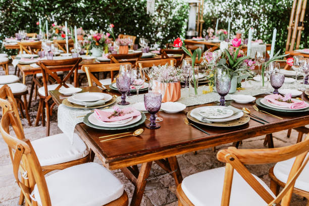 istock terrace with tables setup with flowers and plates on table decorated for Wedding Reception in Latin America 1359079984