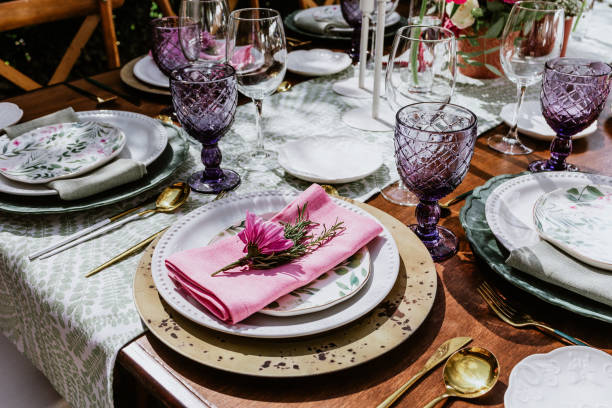 istock table setup with flowers, glasses and plates on table decorated for Wedding Reception in terrace Latin America 1359080551