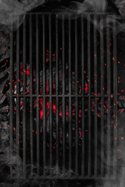 Top view of smouldering charcoals under black cast iron grill grate Top view of smoking smouldering charcoals under black cast iron grill grate ready for food cooking barbecue grill photos stock pictures, royalty-free photos & images