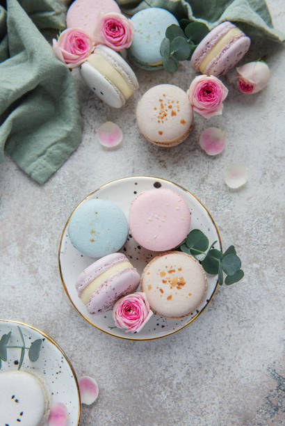 istock Beautiful colorful tasty macaroons on a concrete background 1359081925